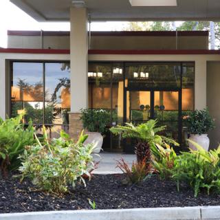 Best Western Plus Garden Court Inn | Fremont, California | View of hotel entrance and garden