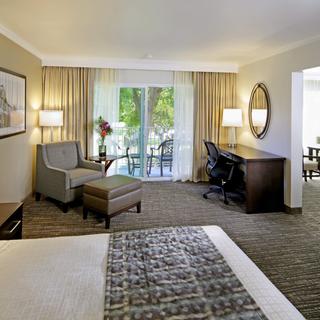 Best Western Plus Garden Court Inn | Fremont, California | King bedroom suite with balcony and seating area