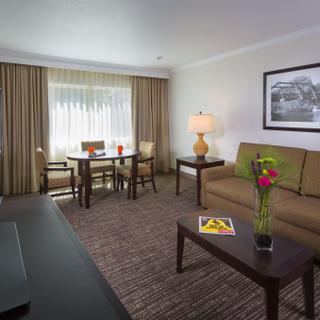 Best Western Plus Garden Court Inn | Fremont, California | Hotel suite with couch and television