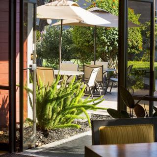 Best Western Plus Garden Court Inn | Fremont, California | View of the outdoor patio from inside the hotel